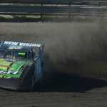 Photo by Rashah McChesney/Peninsula Clarion Mike Braddock rounds a curve during a stock car race Friday July 4, 2014 at the Twin Cities raceway in Kenai, Alaska.