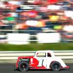 Photo by Rashah McChesney/Peninsula Clarion .... races past the crowd during a Legend car race Friday July 4, 2014 at the Twin Cities Raceway in Kenai, Alaska.