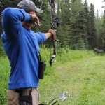 Photo by Dan Balmer/Peninsula Clarion Gerald Bickford from Anchorage lines up his shot and prepares to release his arrow at a 3-D Rinehart moose target at the Independence Day Marked 3-D Archery Shoot Tournament Sunday at the Kenai Peninsula Archery Range in Soldotna. The statewide tournament drew 76 archers for the two-day competition.