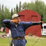 Photo by Dan Balmer/Peninsula Clarion Kenai resident John Lindgren takes aim with his traditional longbow at the Independence Day Marked 3-D Archery Tournament Sunday at the Kenai Peninsula Archery Range in Soldotna. Lindgren won the traditional division with 670 points accumulated from 45 targets over the two-day tournament.