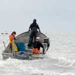 Photo by Rashah McChesney/Peninsula Clarion  Commercial set gillnetters push their skiff further into the Cook Inlet as they race to pick salmon from their nets Wednesday July 9, 2014 in Kenai, Alaska.