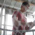 Photo by Rashah McChesney/Peninsula Clarion Brandt Krieger weaves a net onto a hoop while making a dipnet Wednesday July 9, 2014 at Mike's Welding in Sterling, Alaska.
