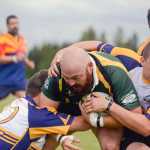 Photo by Rashah McChesney/Peninsula Clarion  Kenai River wolfpack Fred Koski is taken to the ground during a rugby game for the the Between the Tides Dipnet Tournament Saturday July 12, 2014 in Kenai, Alaska.