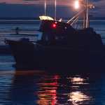 Photo by Rashah McChesney/Peninsula Clarion A commercial drift gillnetting boat leaves the mouth of the Kasilof River at about 1 a.m. Thursday morning July 17, 2014 during an overnight fishing period in Kasilof, Alaska.