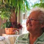 Photo by Rashah McChesney/Peninsula Clarion Sharon Brower, owner of Grouchy Old Woman bed and breakfast, walks through her greenhouse Friday July 18, 2014 in Nikiski, Alaska. Brower said she supports the idea of a bed tax.
