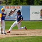 Photo by Rashah McChesney/Peninsula Clarion  Twins' Dallas Pierren rounds second base during a game against Bartlett Saturday July 19, 2014 in Kenai, Alaska.