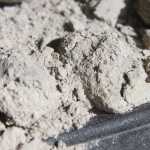 Photo by Kelly Sullivan/ Peninsula Clarion The coals must be constantly monitored to properly cook with a Dutch oven, Saturday, July 19, in Soldotna.