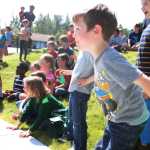 Photo by Kelly Sullivan/ Peninsula Clarion Hayden Carr, 4, jumps up after watching a piece of Mentos candy fizz and explode inside a 2-liter bottle of soda, Tuesday, July 22, at the Joyce K. Carver Soldotna Public Library.