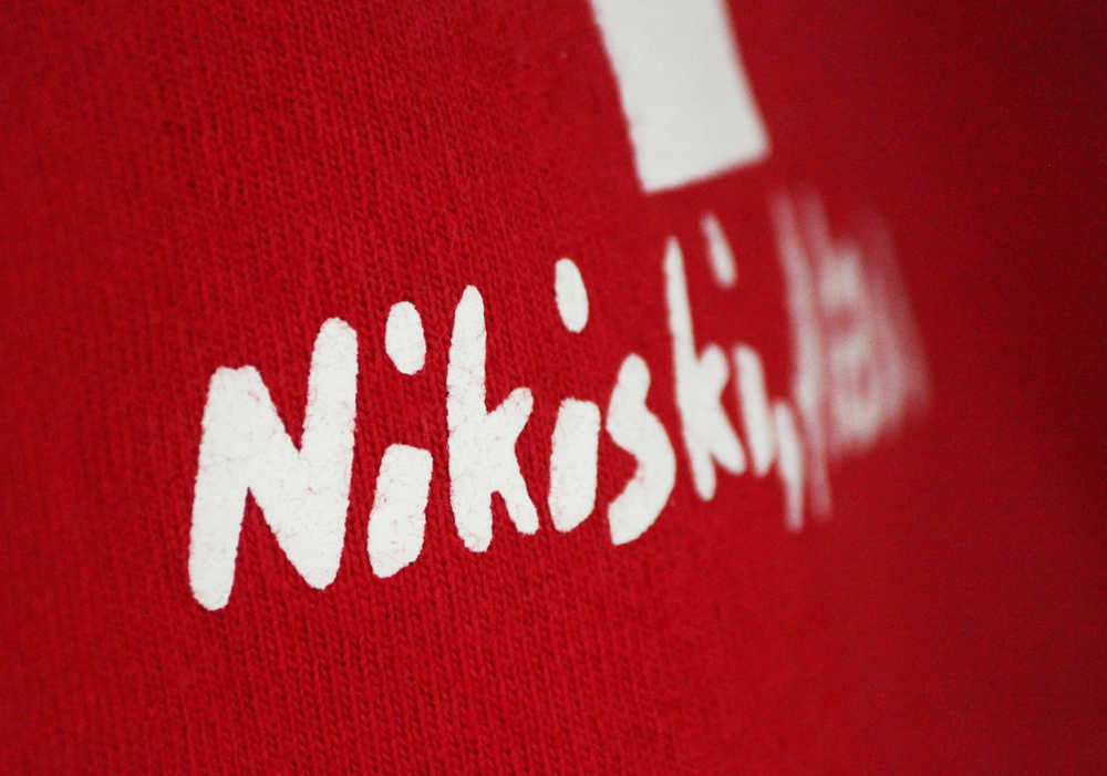 Photo by Kelly Sullivan/ Peninsula Clarion Landon Lightfoot jumps into the Nikiski pool during a training scenario, June 30, at the Nikiski Pool.