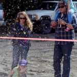 Photo by Rashah McChesney/Peninsula Clarion (left) Hailey, Sondra, Roy and Taylor Stonecipher watch as Carmen West, of Hatcher Pass, works on a chainsaw carving during the Soldotna Progress Days festival Saturday July 26, 2014 at the Soldotna Little League fields.