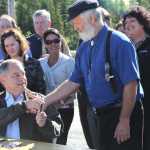 Gov. Sean Parnell shakes hands with Rep. Paul Seaton, R-Homer, after signing House Bill 75 on Tuesday at the Snowshoe Gun Club. The bill amends the Pick. Click. Give program to no longer require organizations with a budget of more than $250,000 to be audited. It also allows Alaskans to donate a portion of their permanent fund dividend to sustain the program. Photo by Kaylee Osowski/Peninsula Clarion