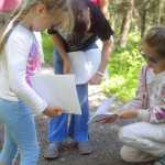 Photo by Kelly Sullivan/ Peninsula Clarion Angela Johnson and Nicole Johnson draw dried mushrooms they found on the ground during their walk in the Family Explorer Program, Saturday, August 2, 2014, on the Keen-Eye Nature Trail in Soldotna.