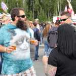 Photo by Dan Balmer/Peninsula Clarion Justin Miller from Anchorage grooves to the music while endulging in the "Hoppin' Salmon Wheat" from the Kenai River Brewing Company at the Kenai Peninsula Beer Festival in Soldotna Saturday. More than 15 breweries from all around the state participated in the festival, a fundraiser for the Rotary Club of Soldotna with benefits going to local Rotary projects.