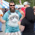 Photo by Dan Balmer/Peninsula Clarion Justin Miller from Anchorage grooves to the music while endulging in the "Hoppin' Salmon Wheat" from the Kenai River Brewing Company at the Kenai Peninsula Beer Festival in Soldotna Saturday. Twenty-two breweries from all around the state participated in the festival, which served as a fundraiser for the Rotary Club of Soldotna with benefits going to local rotary projects.