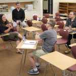 A group of Soldotna Prep teachers collaborate on Friday. Photo by Kaylee Osowski/Peninsula Clarion