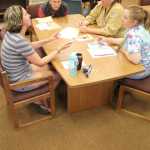 A group of Soldotna Prep teachers collaborate on Friday. Photo by Kaylee Osowski/Peninsula Clarion