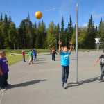 Photo by Kelly Sullivan/ Peninsula Clarion Isabella Wolfe and Sydney Junkert hang from the monkey bars on the playground at their first recess of the new school year, at Nikiski North Star Elementary School, Tuesday, August 19, 2014, in Nikiski, Alaska.