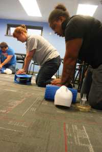 Photo by Kelly Sullivan/ Peninsula Clarion Kenai Peninsula College's resident advisors Ashley Bell, Kirsten McBride and Joshuah Rutten go through CPR training, Friday, August 8, 2014, at the Kenai Peninsula College in Soldotna, Alaska.