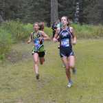 Photo by Jeff Helminiak Soldotna's Olivia Hutchings holds off Colony's Alex Mathis on a downhill Saturday at Tsalteshi Trails during the Tsalteshi Invite. Mathis would finish fourth, while Hutchings would take fifth.