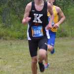 Photo by Jeff Helminiak Kenai Central's Jordan Theisen runs with Kodiak's Levi Fried right on his shoulder with less than a kilometer to go at the Tsalteshi Invitational at Tsalteshi Trails on Saturday. Theisen would beat Fried by five seconds for fifth place.