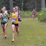 Photo by Jeff Helminiak Megan Pitzman of Homer leads a group of runners down a hill midway through the Tsalteshi Invitational on Saturday at Tsalteshi Trails. Pitzman finished sixth to lead the Mariners to third in the team standings.
