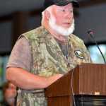Photo by Dan Balmer/Peninsula Clarion Soldotna resident Floyd Frost testifies against the proposed closure of sport hunting of brown bears on the Kenai National Wildlife Refuge at a public hearing Wednesday night at the Soldotna Regional Sports Complex. More than 60 people attended the hearing. A final decision by the refuge is expected to be made today.