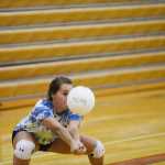 Kelly Sullivan/ Peninsula Clarion Heidi Perkins crouches low to get under the ball, Thursday, August 29, 2014, during the Kenai Central High School girls varsity volley ball practice, at Kenai Central High School, in Kenai, Alaska.
