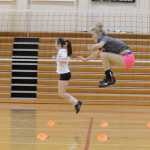 Kelly Sullivan/ Peninsula Clarion Jamie Bagley and Alli Steinbeck practice high jumps, Thursday, August 29, 2014, during the Kenai Central High School girls varsity volley ball practice, at Kenai Central High School, in Kenai, Alaska.