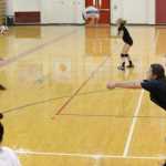 Kelly Sullivan/ Peninsula Clarion Becky Dragseth spikes the ball, Thursday, August 29, 2014, during the Kenai Central High School girls varsity volley ball practice, at Kenai Central High School, in Kenai, Alaska.