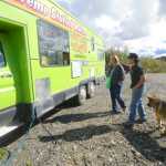 Photo by Kelly Sullivan/ Peninsula Clarion Dean Bostwick and his dog Buddy stop at the AK Taco Shack food truck, for the first time while waiting to get his tires fixed at Johnson's Tire Service, Friday, August 29, 2014 in Soldotna, Alaska.