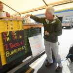 Photo by Kelly Sullivan/ Peninsula Clarion Regular Benny Holly makes an afternoon stop at the AK Taco Shack food truck, which is owned by Shannon Lindley and Mike Beals, Friday, August 29, 2014 in Soldotna, Alaska.