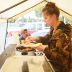 Photo by Kelly Sullivan/ Peninsula Clarion Kim Goggia and Mario Gomez made their first trip to the Wook Waffaz Waffle Emporium food truck, Friday, August 29, 2014 in Soldotna, Alaska.
