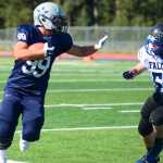 Photo by Kelly Sullivan/ Peninsula Clarion Soldotna High School's Trevor Walden tries to avoid an intercept from Jase Lippert, Saturday, August 30, 2014 during the varsity game against Thunder Mountain high school at Soldotna High School in Soldotna, Alaska.