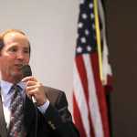 Photo by Rashah McChesney/Peninsula Clarion  Kenai Peninsula Borough Mayor Mike Navarre talks to a crowd during a borough mayor candidate forum at a Kenai and Soldotna Chambers of Commerce joint luncheon Wednesday September 3, 2014 in Kenai, Alaska.  Navarre faces two challengers for his position.