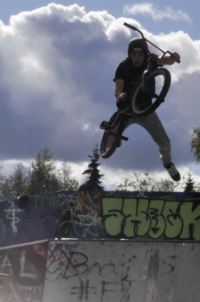 Photo by Rashah McChesney/Peninsula Clarion  Jake Graham gets some air while competing in the 5th Annual Bike & Skate Challenge Saturday Sept. 6, 2014 iat the Soldotna Skate Park in Soldotna, Alaska.