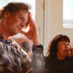 Photo by Rashah McChesney/Peninsula Clarion  Ryan Peterson, of Anchorage, listens to Ricky Gease, executive director of the Kenai River Sportfishing Association, speak to a group of Russian delegates Wednesday September 10, 2014 in Soldotna, Alaska. Peterson acted as an organizer and guide for the group as they travelled around Anchorage and the Kenai Peninsula.