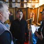 Photo by Rashah McChesney/Peninsula Clarion (left) Evgeny Demidov, of Sakhalin, listens to Father Thomas Andrew, of Kenai, as Leila Loder, of Oregon, translates during a visit to the Holy Assumption of Mary Russian Orthodox Church Thursday September 11, 2014 in old town Kenai, Alaska.