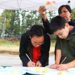 Photo by Kelly Sullivan/ Peninsula Clarion Photo by Kelly Sullivan/ Peninsula Clarion Cana Howard, Ibri Howard and Vellena Howard blind taste tested and rated 15 apples, Sunday, September 14, 2014 in at O'Brien Garden and Trees in Nikiski, Alaska.