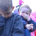 Photo by Kelly Sullivan/ Peninsula Clarion Teagan Pate secretly kept his eyes open when Kenai Watershed Forum's Educational Specialist Dan Pascucci asked the students of Sara Boersma and Robyn Zinszer at the Kaleidoscope School of Arts and Science to close their eyes and point out a specific kind of vegetation during their class walk on the Shqui Tsatnu Creek Trails, Wednesday, September 17, 2014 in Kenai, Alaska.