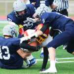 Photo by Kelly Sullivan/ Peninsula Clarion The Soldotna Stars bring down Faribanks' West Valley Wolf Pack's Joshua Cummings, Saturday, September 27, 2014 at Soldotna High School in Soldotna, Alaska.