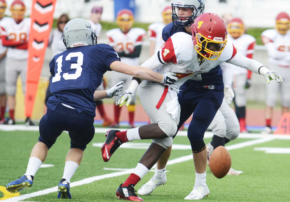 Photo by Kelly Sullivan/ Peninsula Clarion Soldotna Stars Dylan Ackerman tackles Faribanks' West Valley Wolf Pack's Dv'nn Cooks, Saturday, September 27, 2014 at Soldotna High School in Soldotna, Alaska.