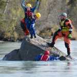 Photo by Rashah McChesney/Peninsula Clarion  Jessica Roper jumps off of Eagle Rock Friday September 27, 2014 as emergency personnel swam in the Kenai River for swift water boat training during the 2014 Alaska Fire Conference on the Kenai Peninsula.