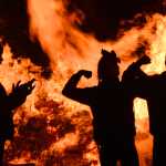 Photo by Rashah McChesney/Peninsula Clarion Students pose for a picture in front of the Kenai Central High School homecoming bonfire Friday Sept. 26, 2014 in Kenai, Alaska.