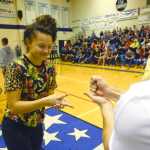 Photo by Rashah McChesney/Peninsula Clarion Lindsey wong, junior, throws "scissors" during a "Rock, Paper, Scissors" game held Sept. 25, 2013 at Soldotna High School during homecoming week in Soldotna, Alaska.
