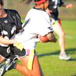 Photo by Kelly Sullivan/ Peninsula Clarion At the Nikiski High School-Middle School Powder Puff flag football game one of the the school's homecoming week activities, two teams made up of High School Senior and Freshmen girls competed against the Juniors and Sophomores, Thursday, September 25, 2014 in Nikiski, Alaska.