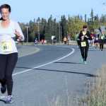Hannah Wagner, of Anchorage, leads a group of half marathon runners on Bridge Access Road in Kenai during the Kenai River Marathon on Sunday. Photo by Kaylee Osowski/Peninsula Clarion