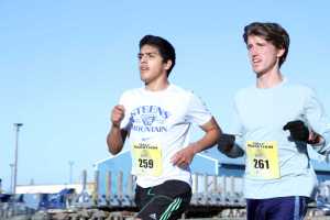 Pedro Ochoa (left), of Homer, and Allan Spangler, of Anchorage, run the half marathon during the Kenai River Marathon in Kenai on Sunday.  Photo by Kaylee Osowski/Peninsula Clarion