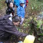 Photo by Kelly Sullivan/ Peninsula Clarion Students in the PEEPS educational progmam hosted by Educational Specialist Michelle Ostrowski went for a walk in the rain at the Kenai National Wildlife Refuge to see the different plants that decomposes vegetation in the refuge, Thursday, September 18, 2014 in Soldotna, Alaska.