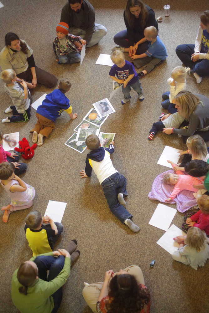 Photo by Kelly Sullivan/ Peninsula Clarion Students in the PEEPS educational progmam hosted by Educational Specialist Michelle Ostrowski at the Kenai National Wildlife Refuge learned about the different plants that decompose vegetation in the refuge, Thursday, September 18, 2014 in Soldotna, Alaska.