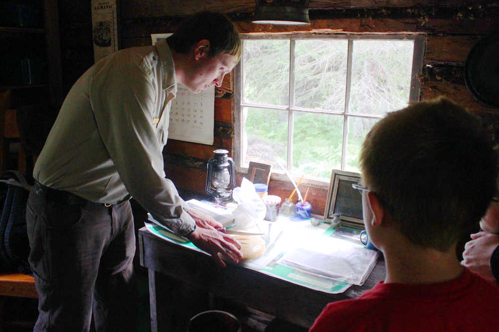 Photo by Kelly Sullivan/ Peninsula Clarion Visitors to the Kenai Wildlife Refuge learned about Andrew Berg at one of a his 11 cabins, Thursday, August 7, 2014 in Soldotna, Alaska.